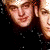 Animated contact sheet of four pixelated faces with varying expressions and lighting, arranged in a 2x2 grid on a gray background.