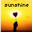 Pixelated image with yellow-orange gradient background, dark silhouette of hand holding heart-shaped object, and black text reading 'sunshine' at top.