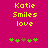 Yellow text reading 'Katie Smiles love' on a pink background with green and brown pixelated shapes below.