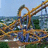 A pixelated image of a roller coaster with a turquoise background and purple text reading "TALON" and "The Grip of FEAR!!!".