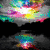Animated sequence showing a colorful abstract sky with clouds transitioning to a heart made of multicolored pixels, then to piano keys.