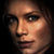 A pixelated close-up of a woman's face and shoulder in an animated contact sheet frame with dark background.