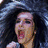 A four- shows a person with long dark hair in different poses: singing into a microphone, neutral expression, and two other angles