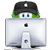 Pixelated figure wearing black cap with white dot, green hair, and light blue eyes, positioned behind silver computer monitor with dark circular camera lens and white base.