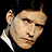 Animated icon featuring a repeated 'WILLARD' text pattern with red glowing elements and partial face images on black background.