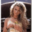 Pixelated image of a woman with long blonde hair wearing a light-colored dress, positioned next to blue background text reading "when you think Tim McGraw i hope you think of me...."