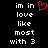 Pixelated text reads 'im in love like most with 3' on black background, red heart symbol appears above the word 'in'.