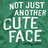 Pixelated green background with white text reading 'NOT JUST ANOTHER CUTE FACE' in stacked lines.