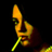 Pixelated yellow and green figure holding a long thin object against black background, static single-frame icon with low-resolution rendering artifacts.
