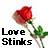 Static pixel art icon featuring a red rose with green leaves and stem, positioned above black text reading "Love Stinks" on a white background.