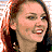 Pixelated image of a woman with reddish-brown hair smiling, overlaid with text and vertical bars.