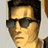 Pixelated close-up of a person with dark hair wearing dark sunglasses, light skin tone, and a neutral expression against a light background.