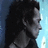 Pixelated profile of a person with dark hair against light blue background, red text on black side reads 'All Alone I Fall To Pieces'