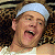 A pixelated image shows a person with light hair wearing a white headband and sleeveless top, next to green text reading 'Original Icons .com' on a dark background.