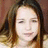 A static image shows a person with long brown hair against a dark background, accompanied by pink pixelated text reading "Follow" and "Your Dream: *peace*".