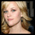 A pixelated split-screen image shows a person with blonde hair in two side-by-side views, one angled left and the other right.