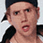 A static image featuring a person with light brown hair wearing a dark cap and black jacket, alongside multiple text elements including 'Yo!', 'JK', 'X', and 'Thursday 9/8c' in various fonts and colors.