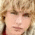 Pixelated image of a person with light brown hair and red clothing, overlaid with handwritten-style text fragments on white background.