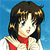 Pixelated image of a character with dark brown hair styled in two buns, wearing a red scarf over a light-colored top against a blue background.