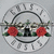 Circular icon with a gray background, featuring two red roses flanking a central black symbol surrounded by an arc of white text.