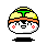 Pixelated cartoon sushi character with yellow rice, green seaweed top, orange band, red cheeks, black hair, and white face showing two expressions.