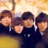 Static 48x48 pixel icon showing four figures in dark suits with white shirts and ties against a blurred yellow background, rendered at low resolution with visible pixelation.