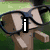 Pixelated image of a hand holding glasses with an 'i' symbol, a cheese block with a heart and Superman logo, and a 'dudebox' text overlay.
