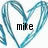 A pixelated heart-shaped frame in shades of blue surrounds the lowercase text 'mike' on a white background.