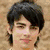A four- shows a person with dark hair and a beret, alongside green text reading "Joe Jonas Is my Loveee!" and red text saying "Joe <3"