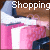 Animated icon showing a person holding pink and white striped bags with 'Shopping' text above, transitioning through three distinct heart-shaped cursor symbols.