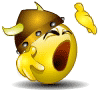 Animated yellow cartoon character with brown helmet and horns, mouth open in a shout, hand raised near face, small floating object above head.
