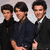 Three young men in dark clothing pose together on the left; a blue with white text reads 'BROTHERS THAT ROCK TOGETHER ROLL TOGETHER' on the right