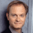 A 48x48 pixel buddy icon split into two sections: a grayscale portrait of a man on the left and green text reading "Original Icons .com" on a dark green background on the right.
