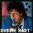 Pixelated image of a person in blue jacket with white shirt and black tie, text 'ROBBIE HART' below, pink heart symbols appear/disappear in upper right.