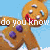 Animated gingerbread man with white icing details and purple buttons, set against a light blue background.