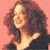 A pixelated contact sheet showing two frames of an animated icon featuring a woman with curly hair on the left and green text reading "Original Icons .com" on the right against a dark background.