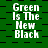 Green background with black checkered pattern and repeated white text "Green Is The New Black" in pixelated font.