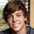 A pixelated image of a person with brown hair and dark clothing on the left, next to green text reading "I Love Ryan Sheckler" on a solid dark background.