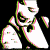 Animated image of a person with tattoos wearing a dark top, showing two color-inverted states and one standard view.