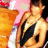 Pixelated image of a person with light skin tone wearing dark clothing, holding an object against a pink and orange background.