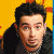 A 50x50 pixel animated buddy icon split into two frames showing a person on the left and green text on the right against a yellow background.