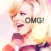 A pixelated close-up of a person with blonde hair holding a microphone, overlaid with bold black text reading "OMG!".