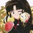 Pixelated image of a person with dark hair holding a yellow object near their face, wearing red and black clothing against a blurred background.