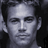 Pixelated grayscale portrait of a person with short dark hair against a black background, displayed as a static 48x48 buddy icon.