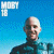 A pixelated contact sheet showing two frames of an animated icon featuring a bald man in a wetsuit against a blue background with "Moby 1B" text and green "OriginalIcons.com" branding on the right.