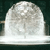 A static pixelated image of a white dome-shaped object with a flat base against a dark background.