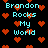 Pixelated text 'Brandon Rocks My World' repeated across a black background with red heart symbols scattered throughout.