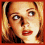 Four- with red border showing close-up of blonde woman's face, eye detail, and 'Buffy' text on black background
