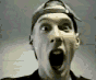 A person wearing a backward cap and dark shirt appears in a sequence of frames showing mouth opening, finger pointing, and facial expression changes.