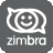 Pixelated grayscale icon featuring a white speech bubble with a smiley face inside, positioned above the word 'zimbra' in lowercase letters on a dark gray background.